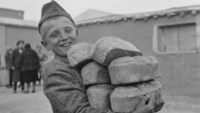 A-Polish-boy-carries-loaves-of-bread-provided-by-the-Red-Cro
